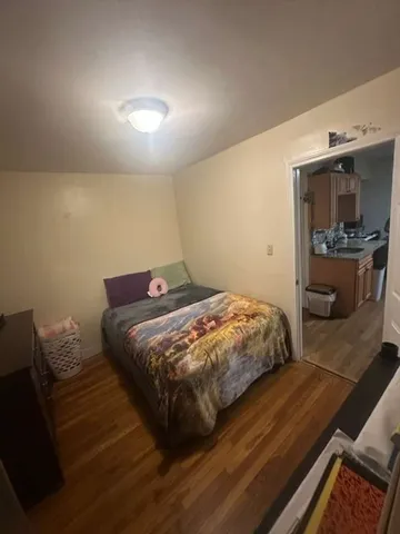 a bedroom with a bed and lamp