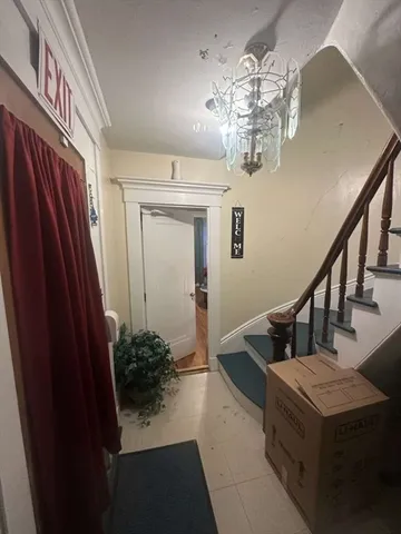 a living room with furniture chandelier and a chandelier