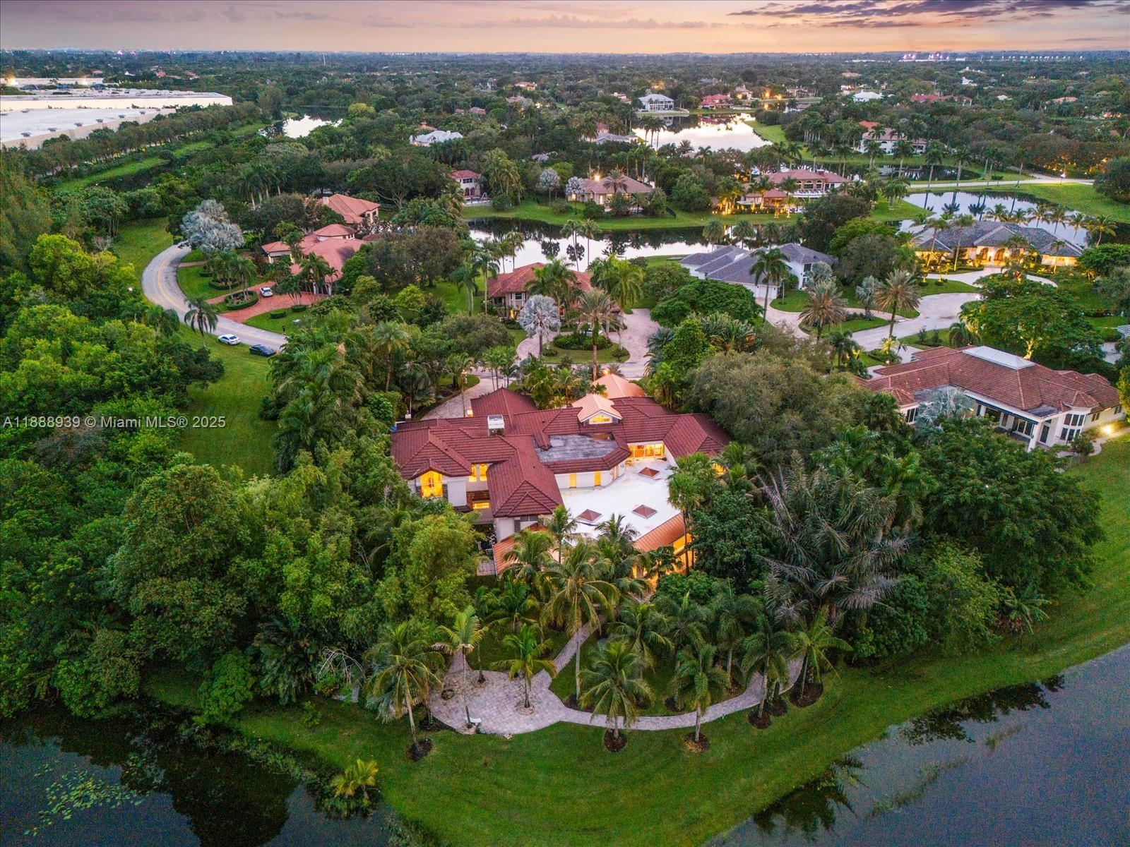 an aerial view of a house with lots of residential buildings and swimming pool