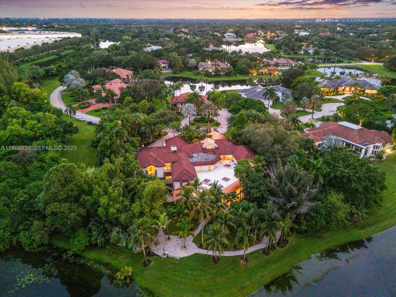 an aerial view of a house with lots of residential buildings and swimming pool