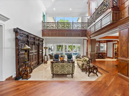 a view of a livingroom with furniture and a window