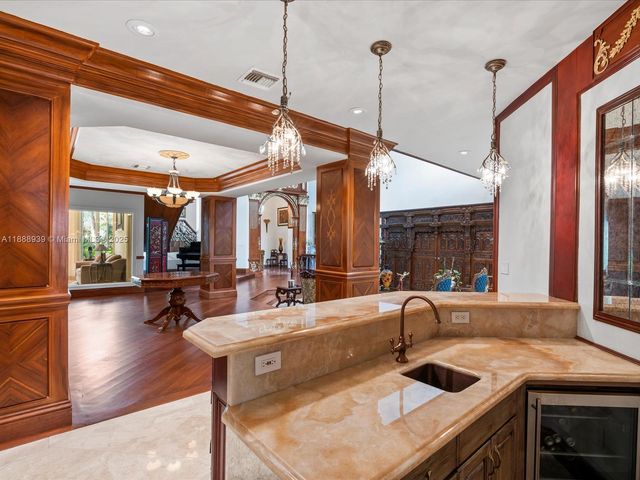 a kitchen with a stove a sink and a refrigerator