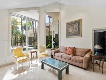 a kitchen with stainless steel appliances granite countertop a sink and a refrigerator