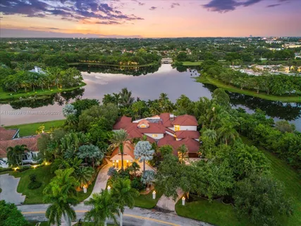 an aerial view of house with yard swimming pool and outdoor seating