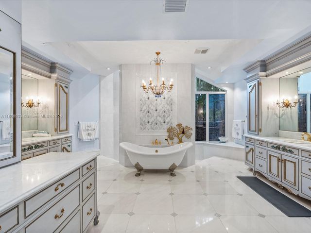 a living room with furniture a rug and a large window
