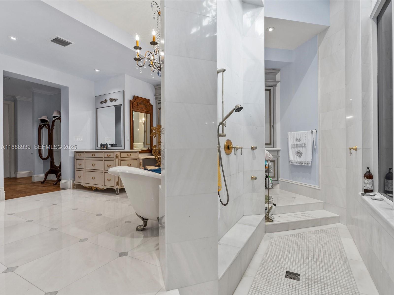 2941 Paddock Lane Weston, FL 33331 - Photo 46 of 90 a bathroom with a double vanity sink mirror and shower