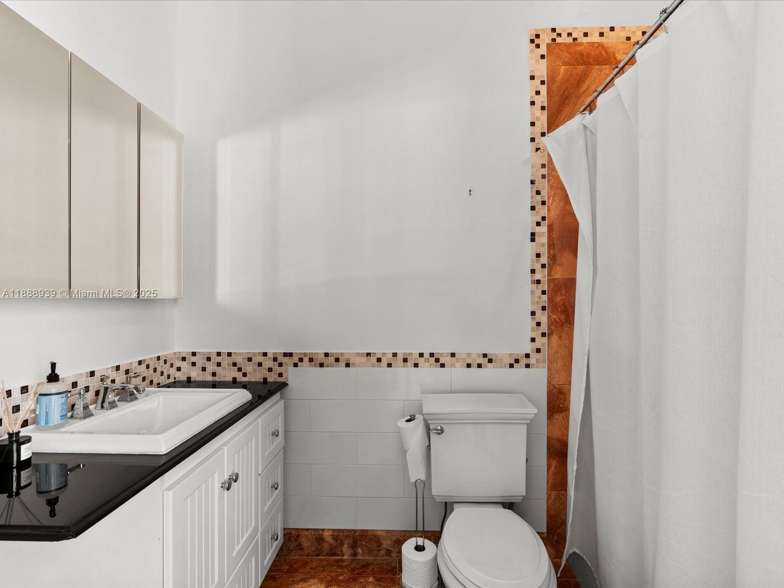 2941 Paddock Lane Weston, FL 33331 - Photo 75 of 90 a bathroom with a sink and a toilet