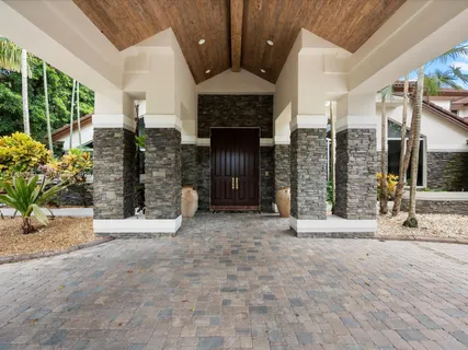 a view of a dining room with furniture wooden floor and chandelier
