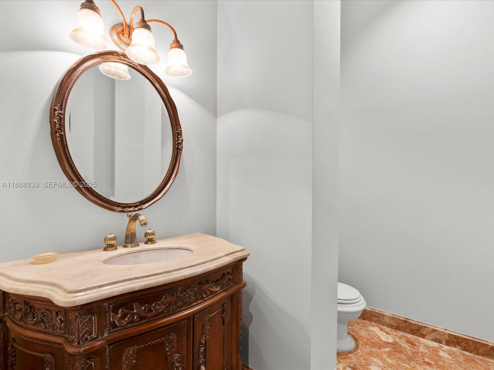 2941 Paddock Lane Weston, FL 33331 - Photo 82 of 90 a bathroom with a sink a toilet and a mirror