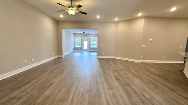a view of a kitchen with microwave and cabinets