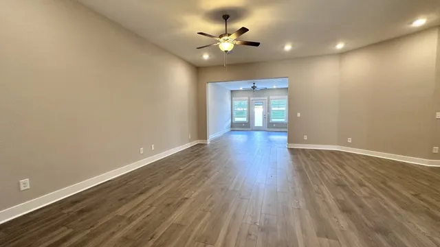 a view of kitchen with sink and wooden floor