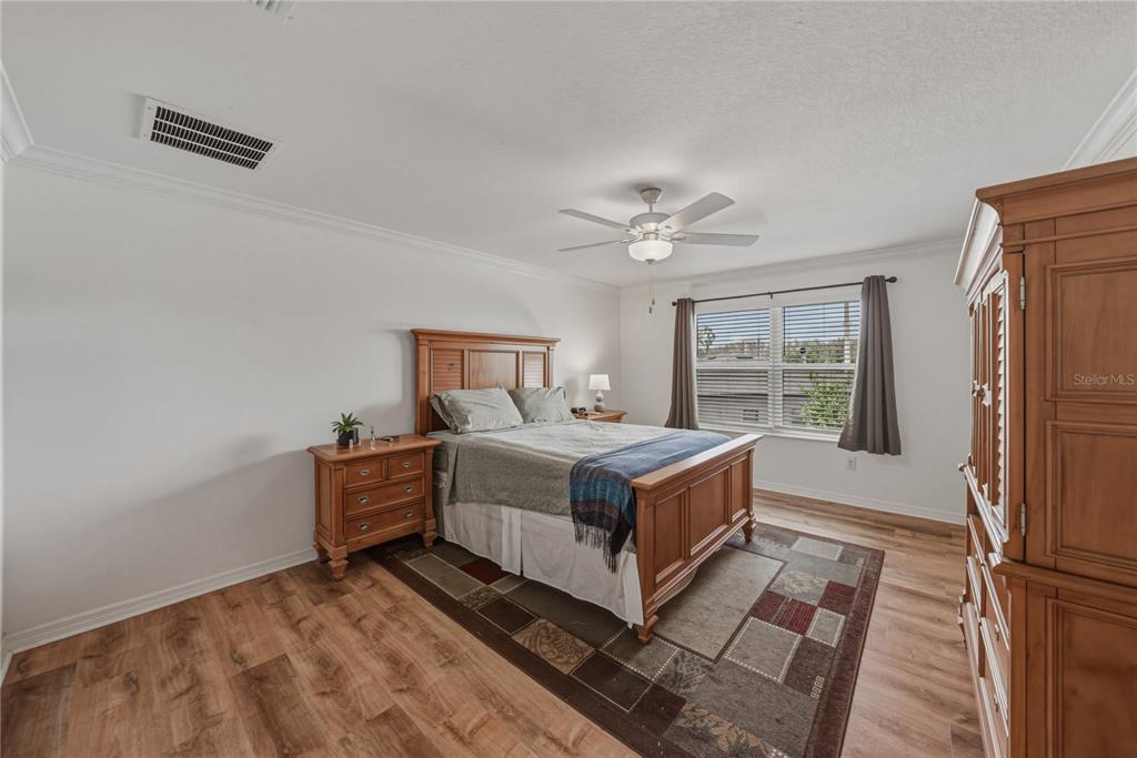 30688 Veridian Way Wesley Chapel, FL 33543 - Photo 23 of 55 a bedroom with a bed and a window