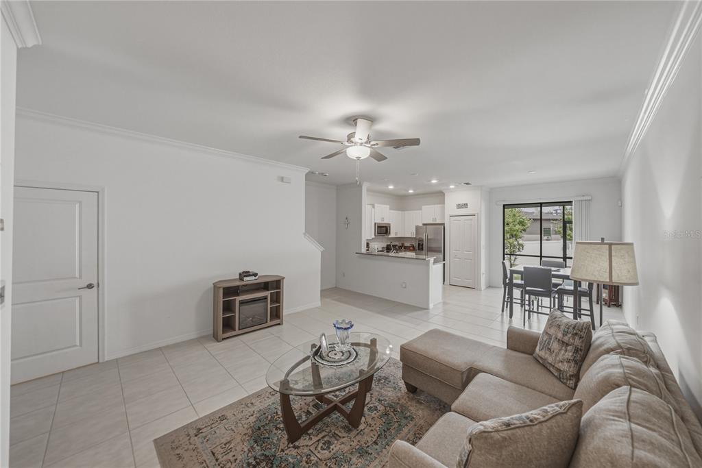 30688 Veridian Way Wesley Chapel, FL 33543 - Photo 3 of 55 a living room with furniture and a view of kitchen