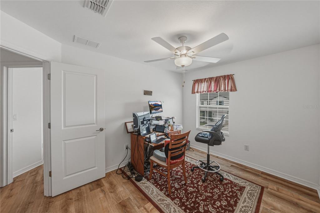 30688 Veridian Way Wesley Chapel, FL 33543 - Photo 35 of 55 a workspace with wooden floor