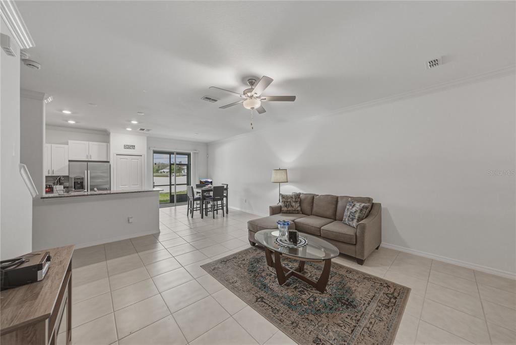 30688 Veridian Way Wesley Chapel, FL 33543 - Photo 4 of 55 a living room with furniture and kitchen view