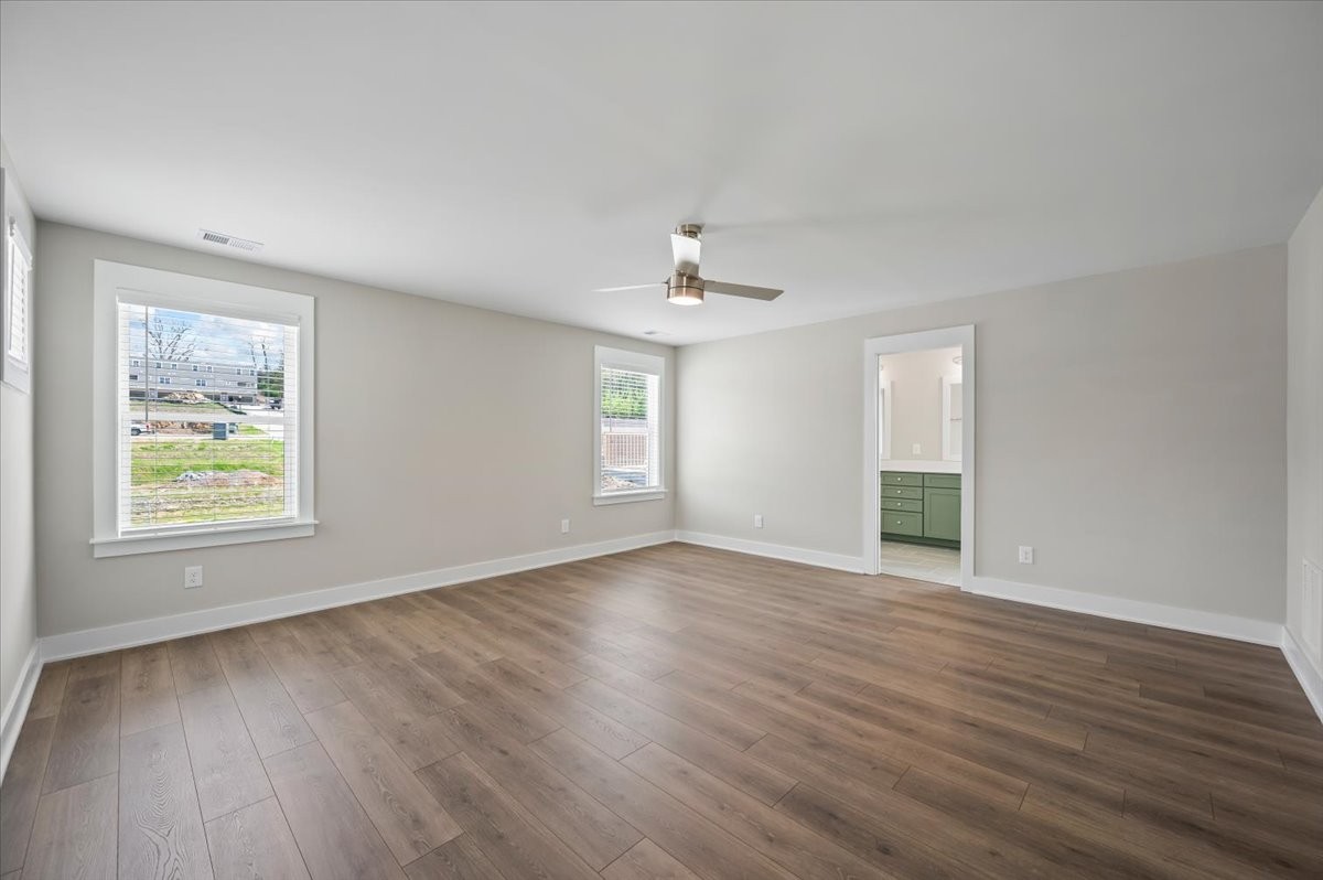 3043 A Hillside Road Nashville, TN 37207 - Photo 12 of 31 a view of an empty room with wooden floor and a window