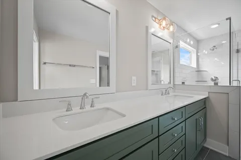 a bathroom with a sink double vanity and a mirror