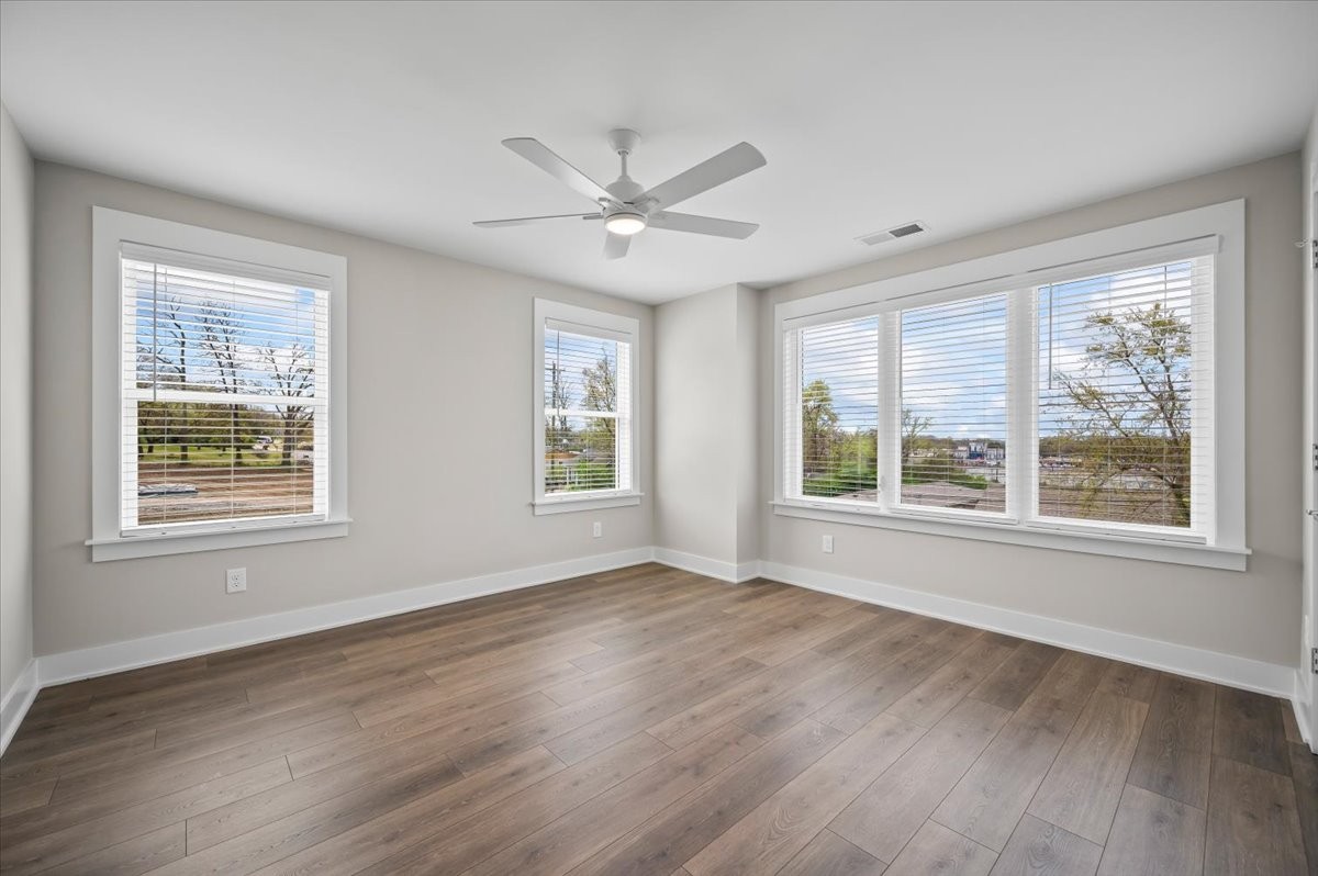3043 A Hillside Road Nashville, TN 37207 - Photo 19 of 31 a view of an empty room with wooden floor and a window