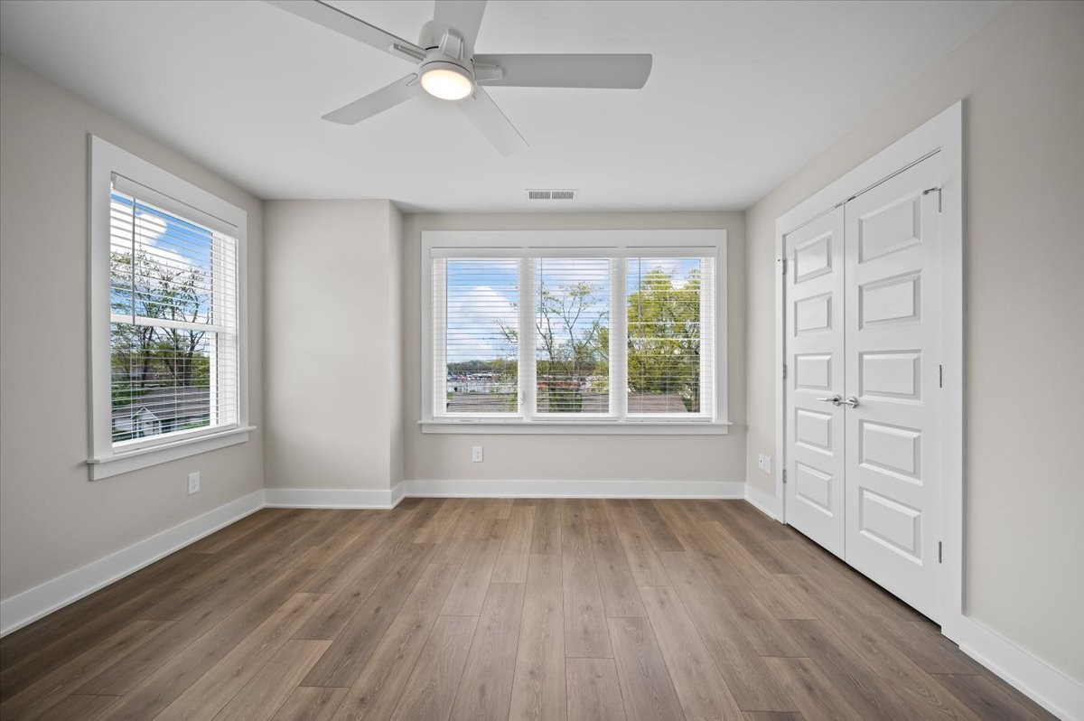 3043 A Hillside Road Nashville, TN 37207 - Photo 20 of 31 a view of an empty room with wooden floor and a window