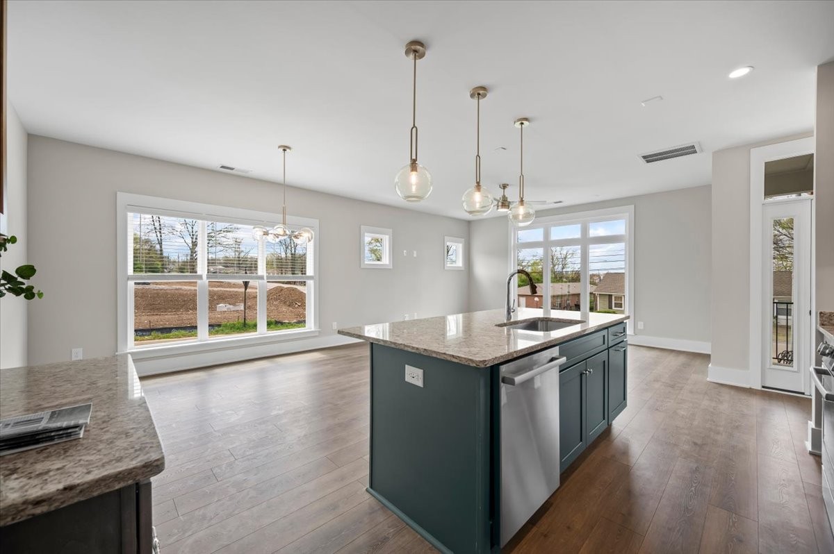 3043 A Hillside Road Nashville, TN 37207 - Photo 7 of 31 a kitchen with granite countertop a sink and a stove
