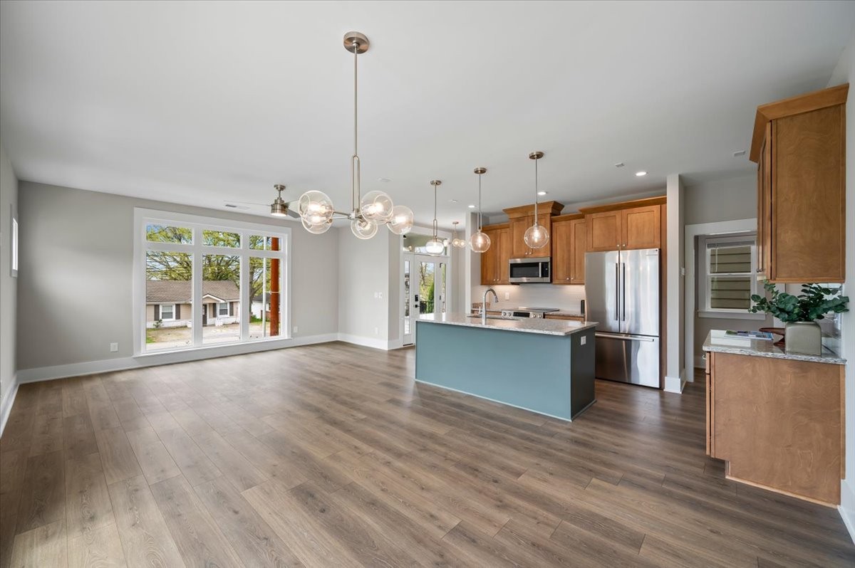 3043 A Hillside Road Nashville, TN 37207 - Photo 10 of 31 a view of a kitchen with kitchen island a large counter top space appliances and cabinets
