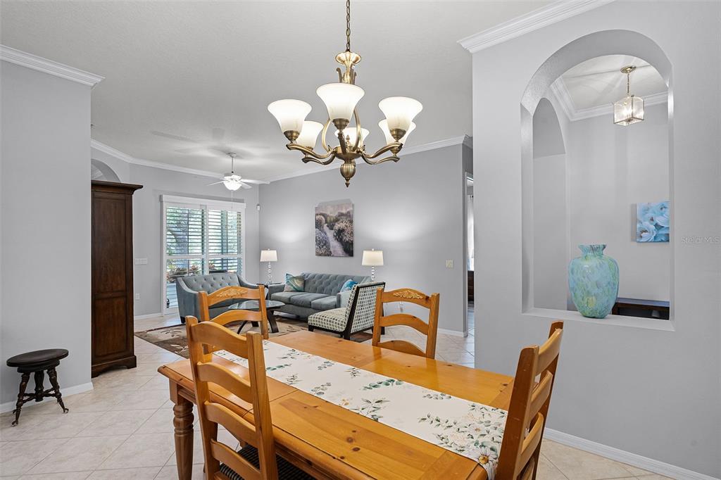 1124 Hidden Bluff Clermont, FL 34711 - Photo 11 of 25 a view of a dining room with furniture and chandelier