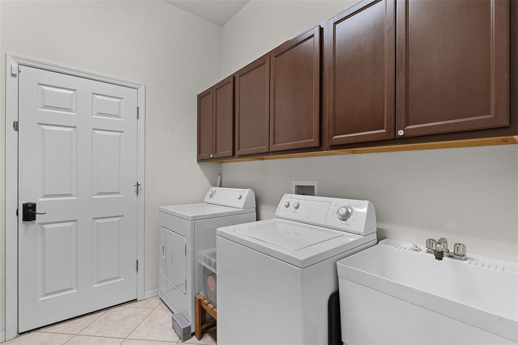 1124 Hidden Bluff Clermont, FL 34711 - Photo 21 of 25 a utility room with dryer and washer