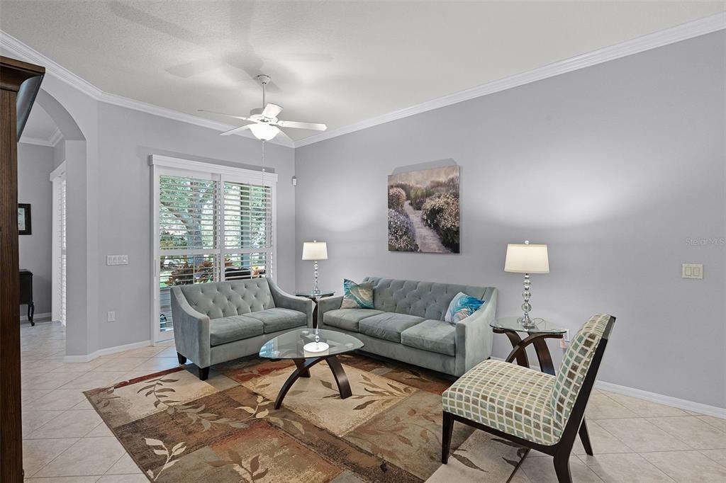 1124 Hidden Bluff Clermont, FL 34711 - Photo 7 of 25 a living room with furniture and a chandelier