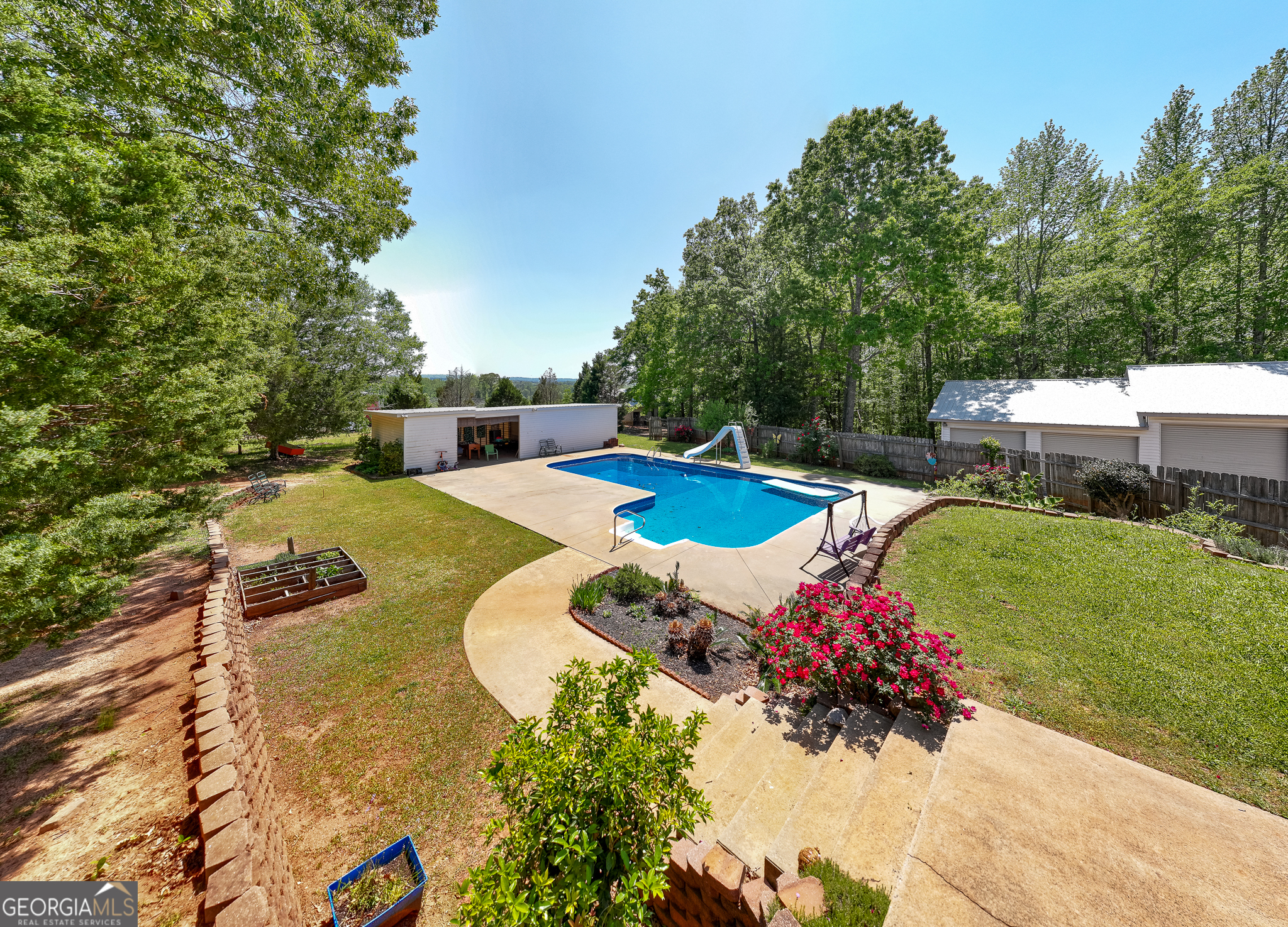1755 Hunsinger Road Shiloh, GA 31826 - Photo 18 of 62 a view of a swimming pool with a garden