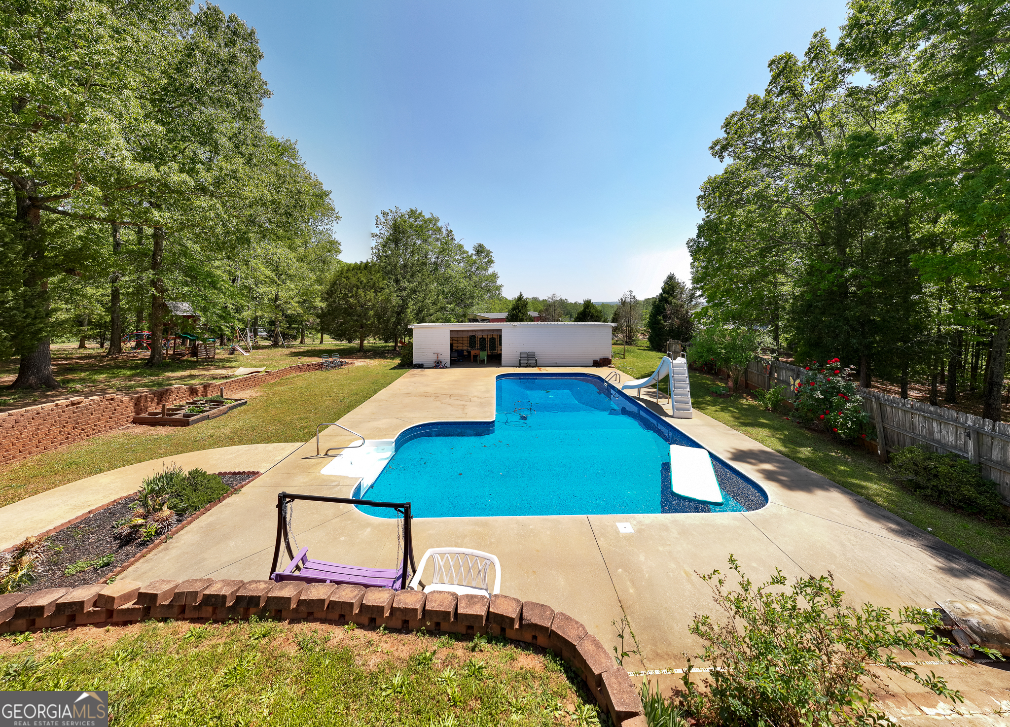 1755 Hunsinger Road Shiloh, GA 31826 - Photo 19 of 62 a view of a swimming pool with lounge chairs