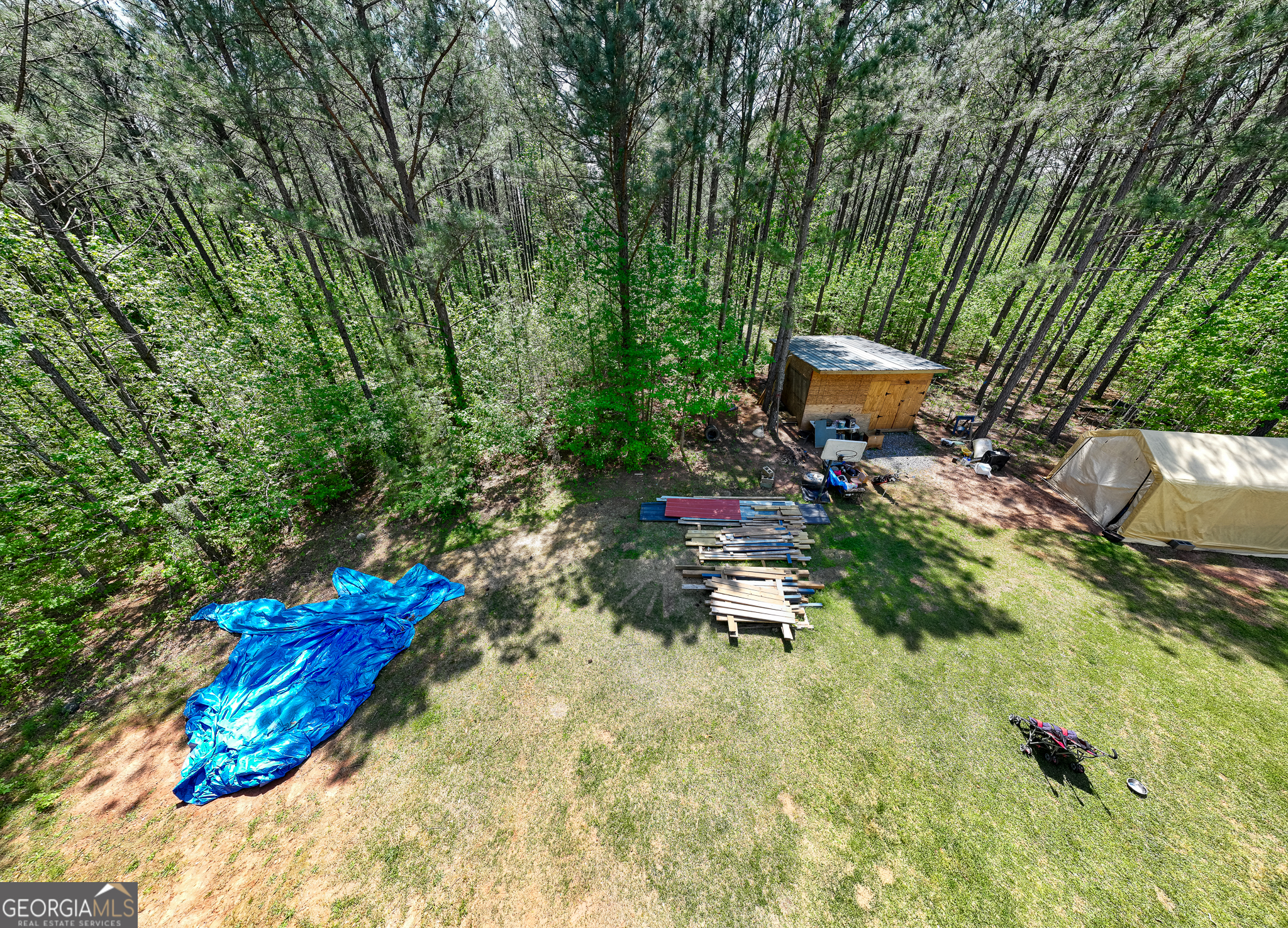 1755 Hunsinger Road Shiloh, GA 31826 - Photo 25 of 62 a backyard of a house with table and chairs