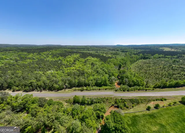 an empty room with floor to ceiling window