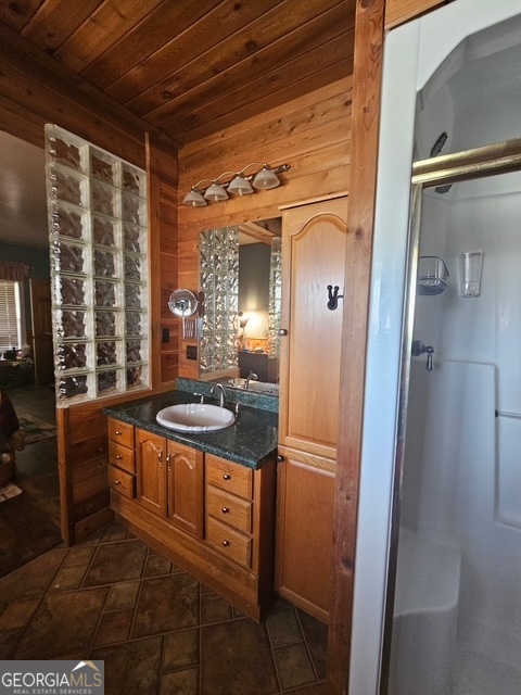 1755 Hunsinger Road Shiloh, GA 31826 - Photo 62 of 80 a bathroom with a granite countertop sink a mirror and a shower