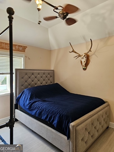 1755 Hunsinger Road Shiloh, GA 31826 - Photo 70 of 80 a bed sitting in a bedroom next to a window