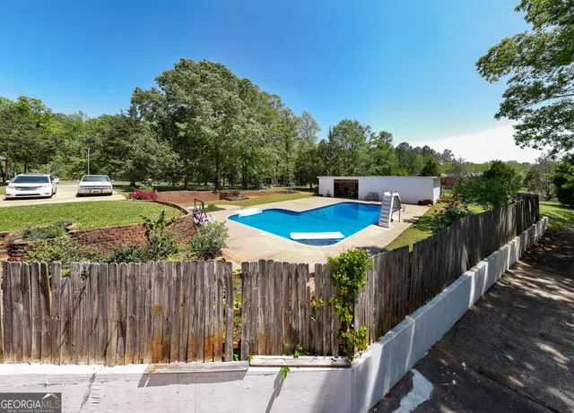 a view of a backyard with large trees