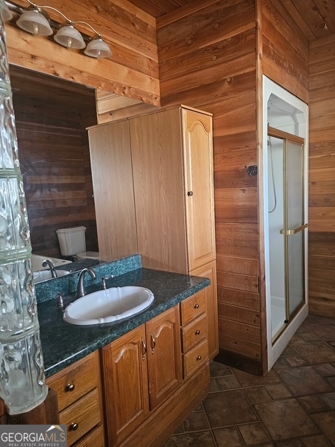 1755 Hunsinger Road Shiloh, GA 31826 - Photo 75 of 80 a bathroom with a granite countertop sink and a mirror