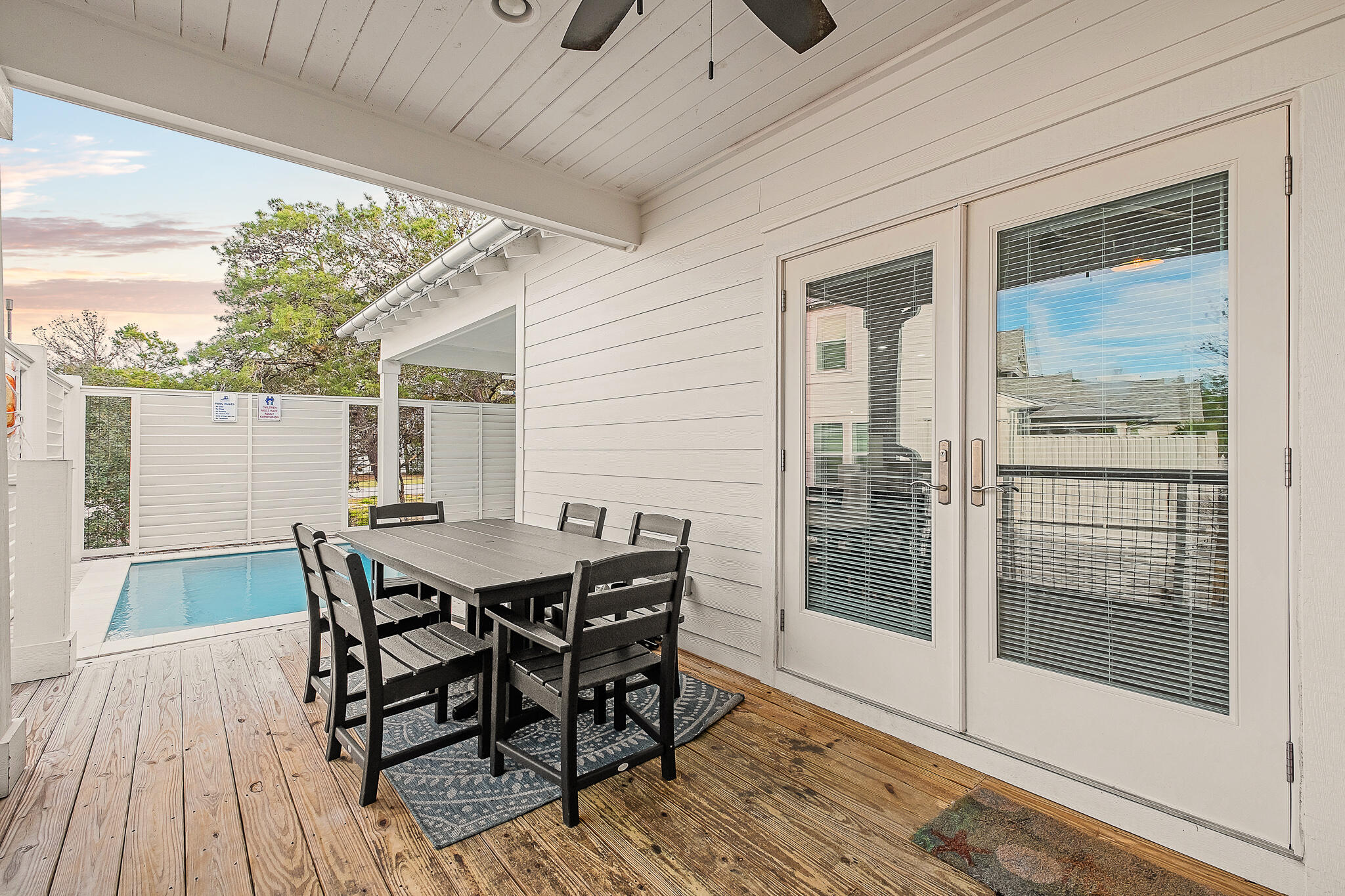 66 Seabreeze Trail Inlet Beach, FL 32461 - Photo 15 of 59 a view of a roof deck with table and chairs and wooden floor