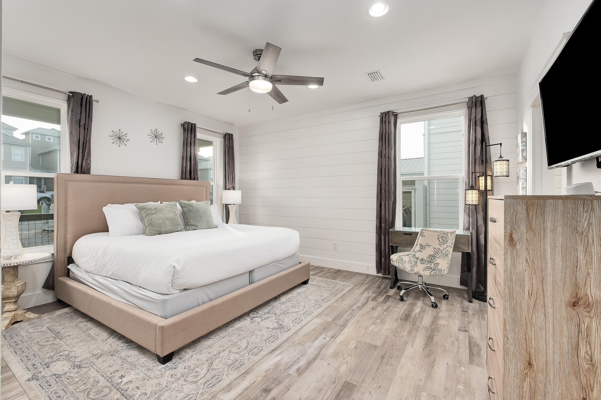 66 Seabreeze Trail Inlet Beach, FL 32461 - Photo 26 of 59 a bedroom with a bed flat screen tv and couches