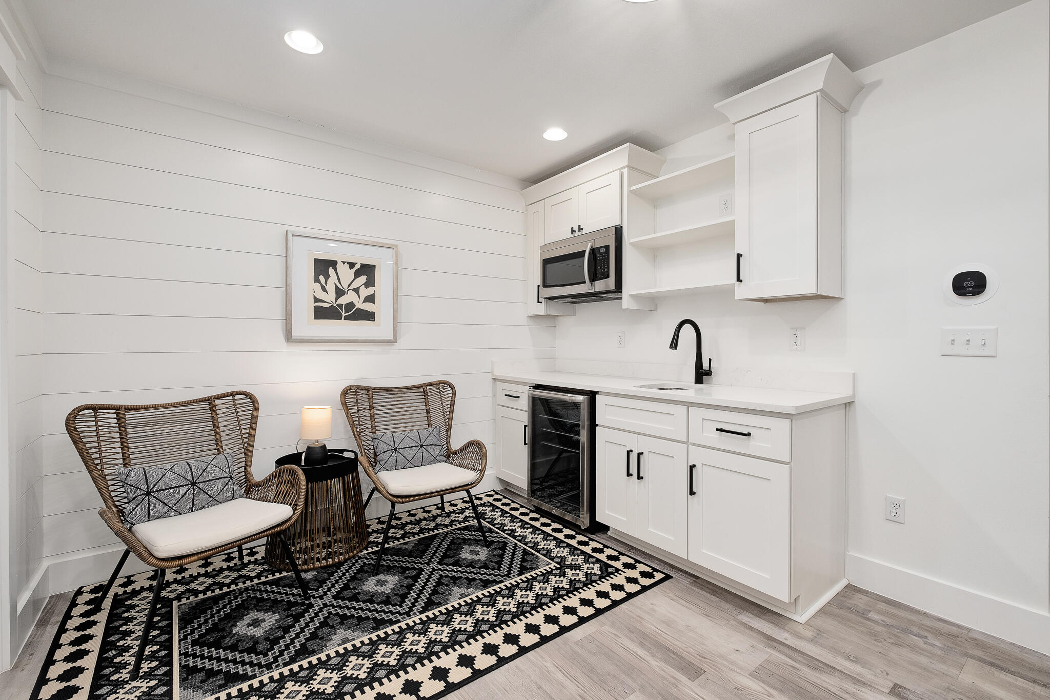 66 Seabreeze Trail Inlet Beach, FL 32461 - Photo 32 of 59 a kitchen with a chair a stove a microwave and dining table