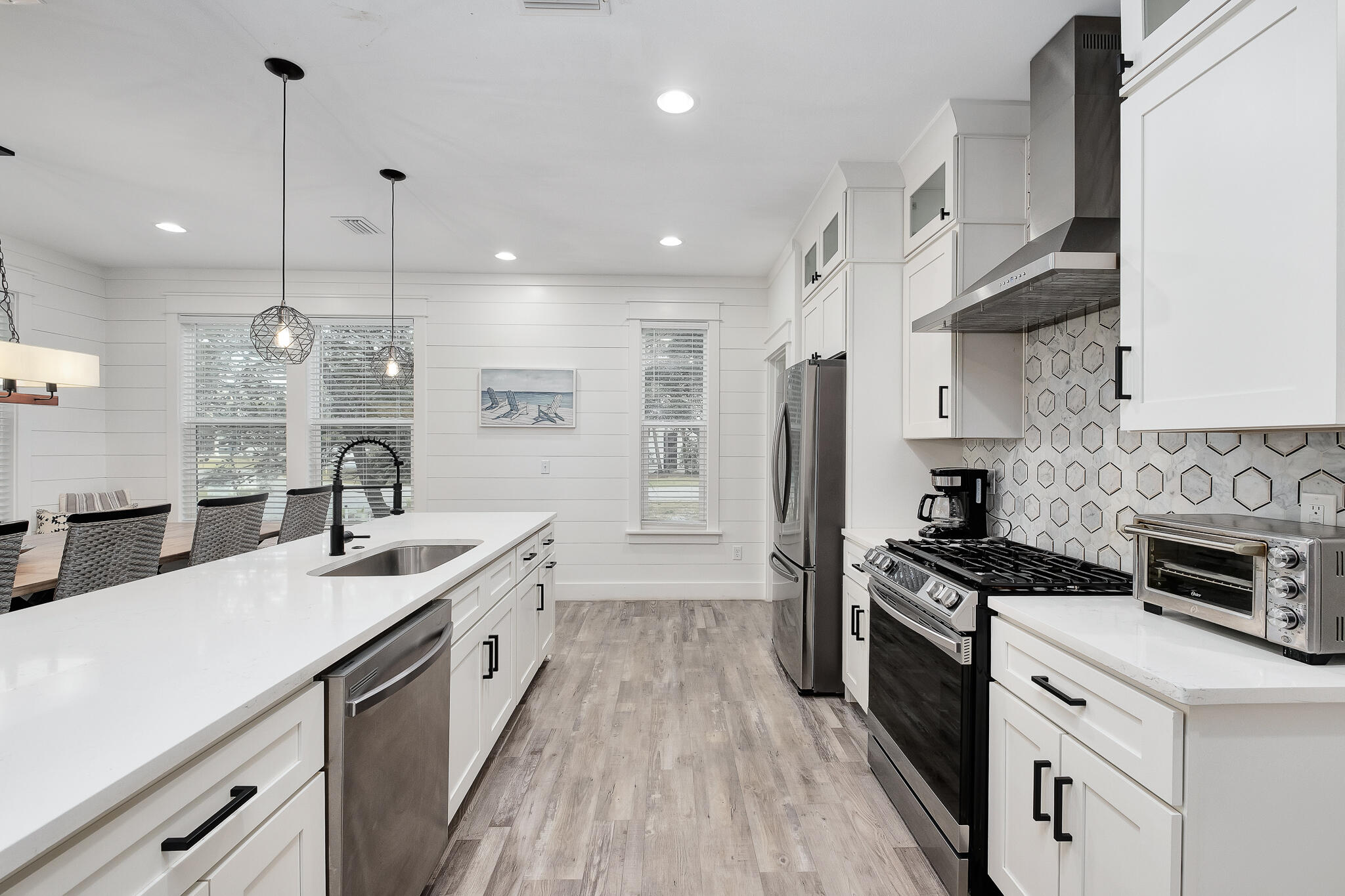 66 Seabreeze Trail Inlet Beach, FL 32461 - Photo 7 of 59 a kitchen with granite countertop a sink a counter space stainless steel appliances and cabinets