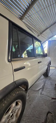 a view of a swimming pool with outdoor seating