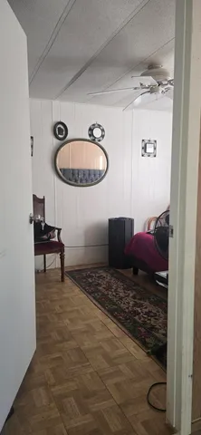 a view of a yard with wooden fence