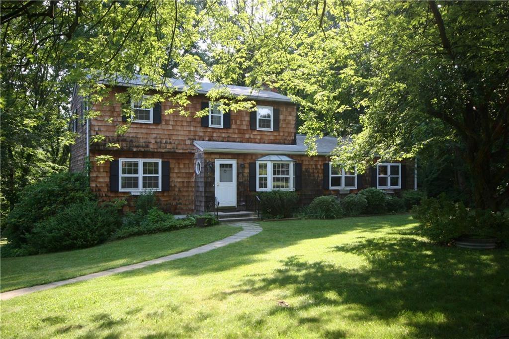 58 Hobby Drive Ridgefield, CT 06877 - Photo 1 of 1 a front view of a house with a yard