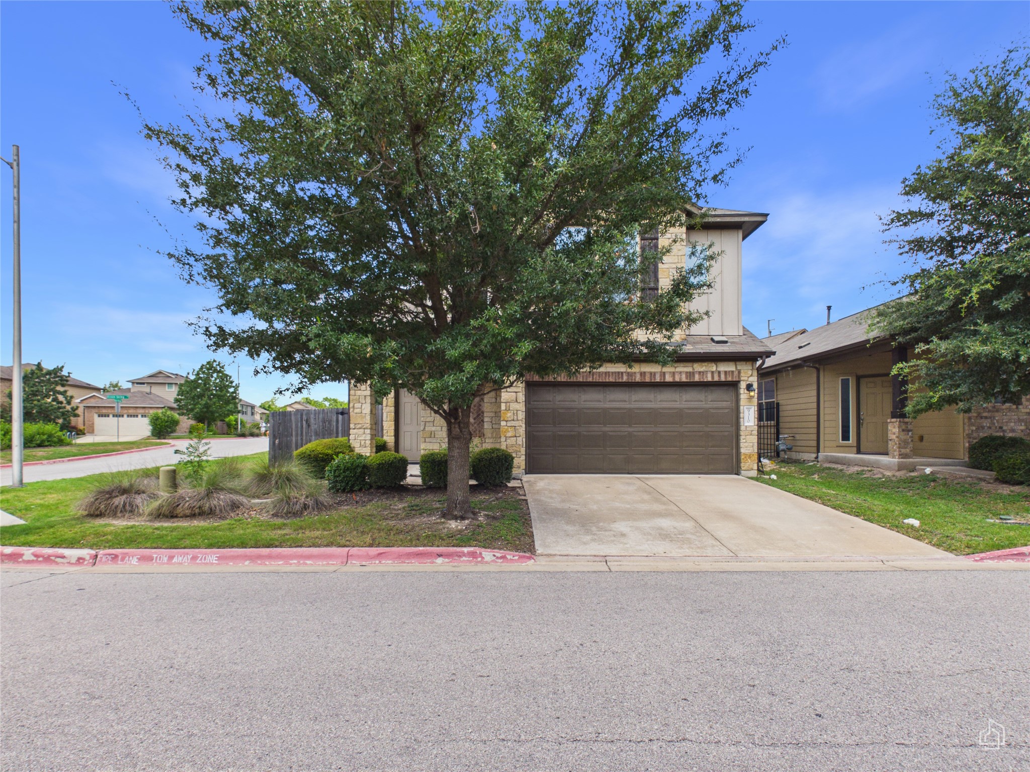 9310 Tanager Way Austin, TX 78748 - Photo 30 of 32 A welcoming stone and siding facade offers excellent curb appeal and a convenient attached garage.