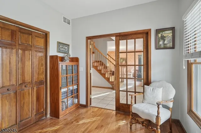 a view of entryway with wooden floor and stairs