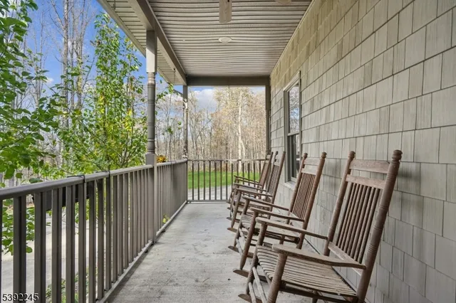 a view of a chair and table in the balcony