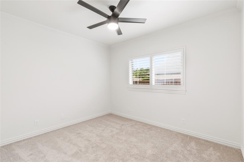 967 East Bethel School Road Coppell, TX 75019 - Photo 34 of 39 Bright room featuring neutral carpeting, white walls, a ceiling fan with integrated lighting, and a window with plantation shutters