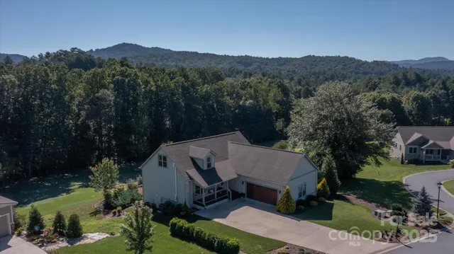 an aerial view of a house with mountain view