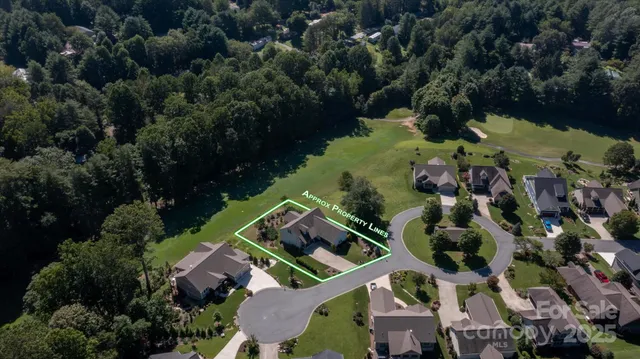 an aerial view of house with yard