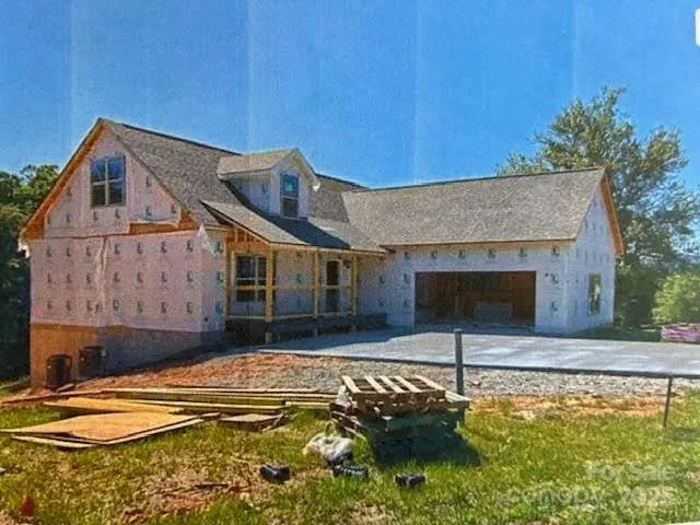 a house with swimming pool in front of it